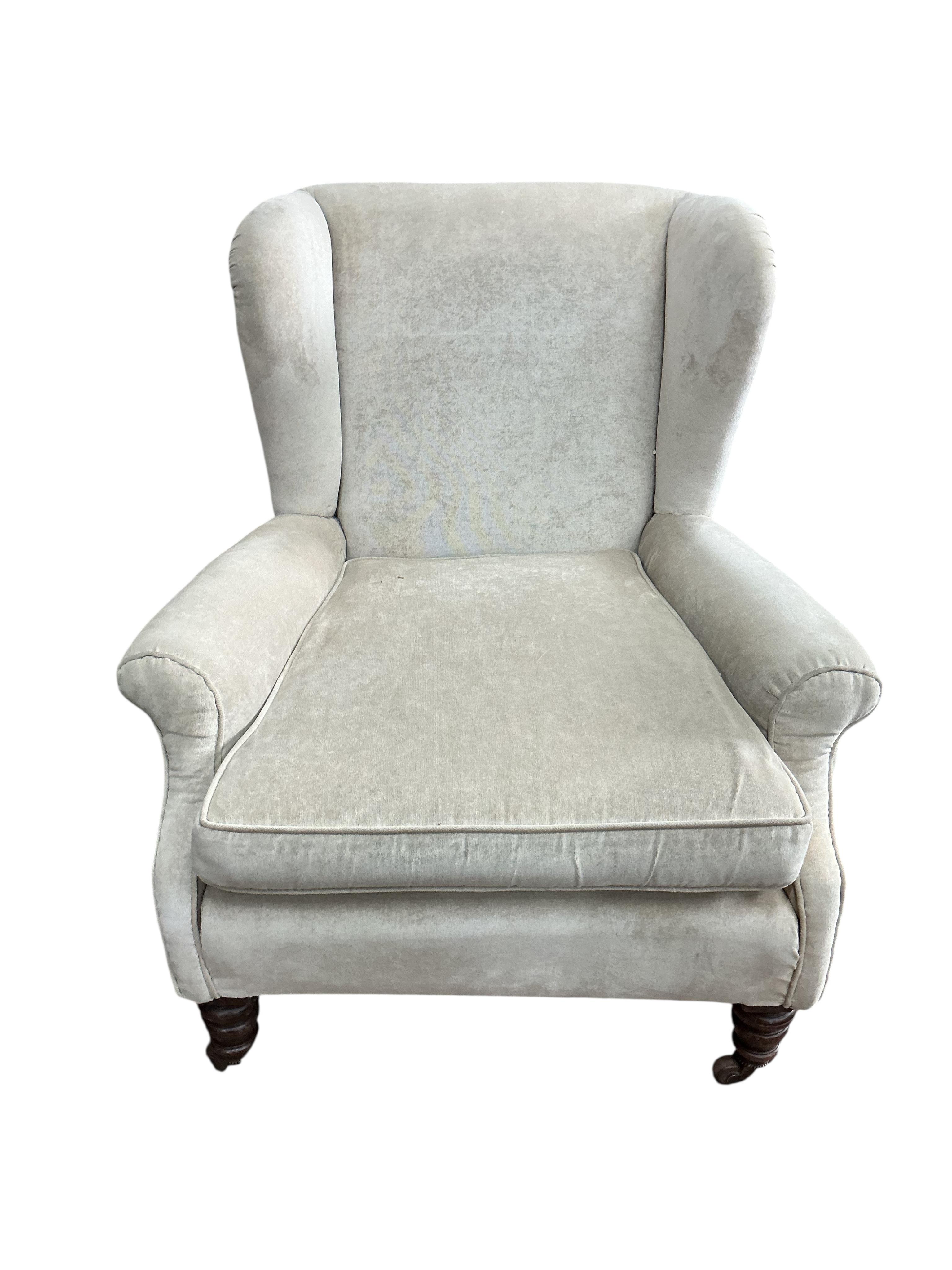 A Victorian upholstered wing armchair, width 80cm, depth 84cm, height 84cm